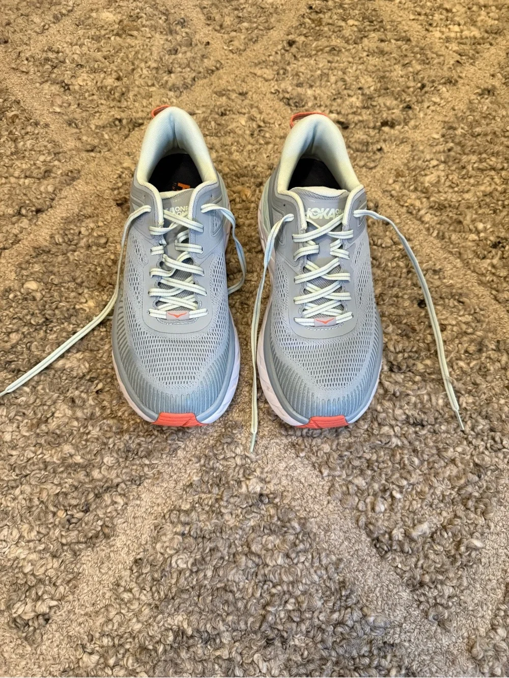 Hoka Pale Gray Running Shoes with orange Accents